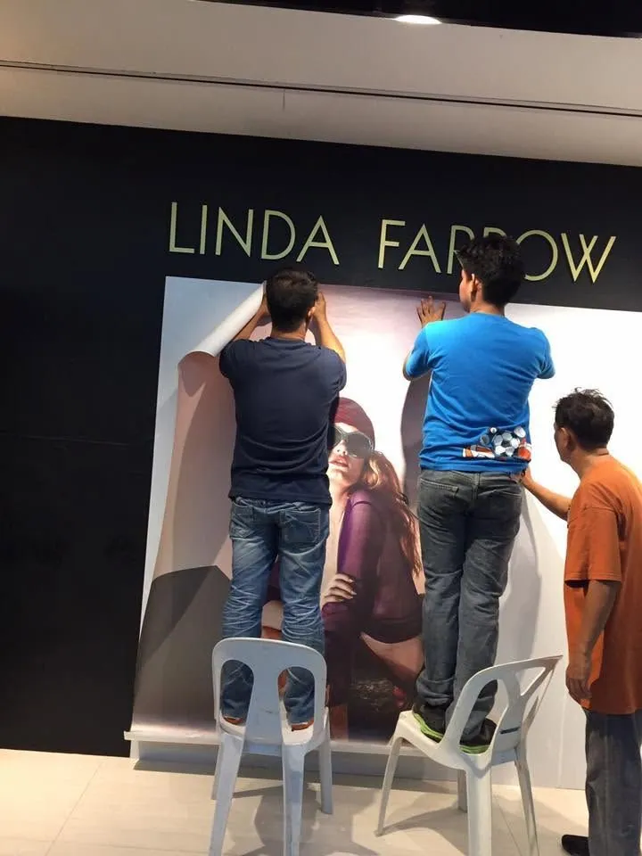 MCAV crew installing a Linda Farrow vinyl graphics