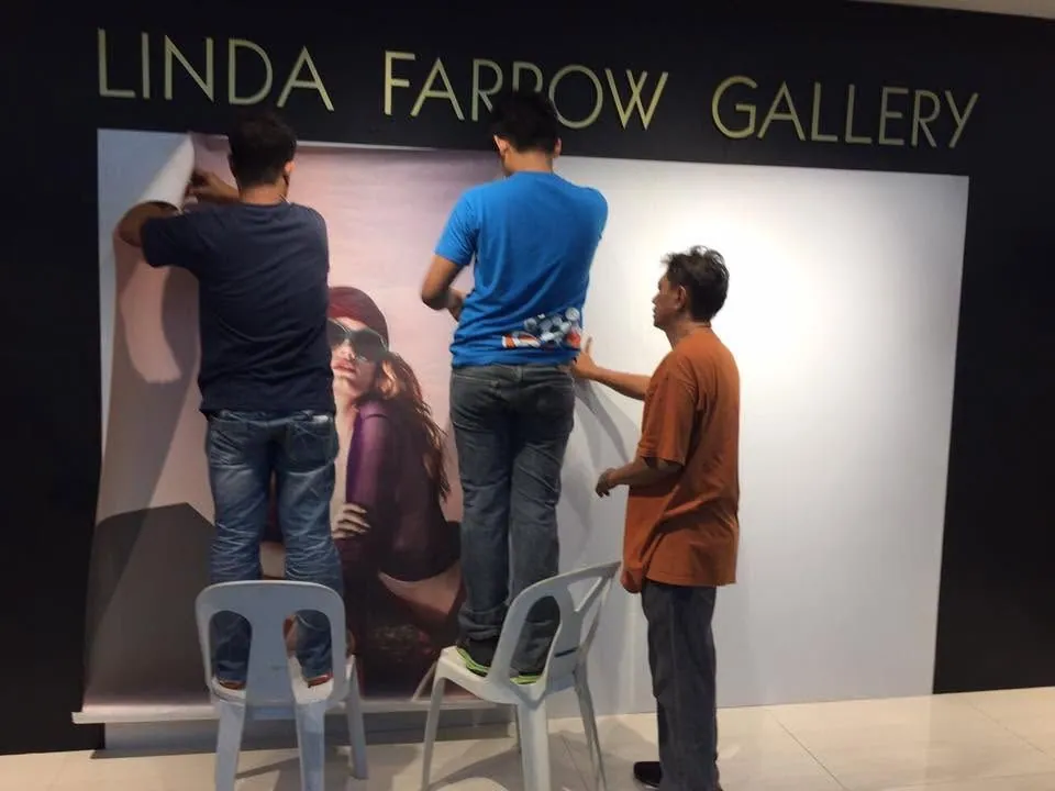 MCAV crew installing a Linda Farrow vinyl graphics