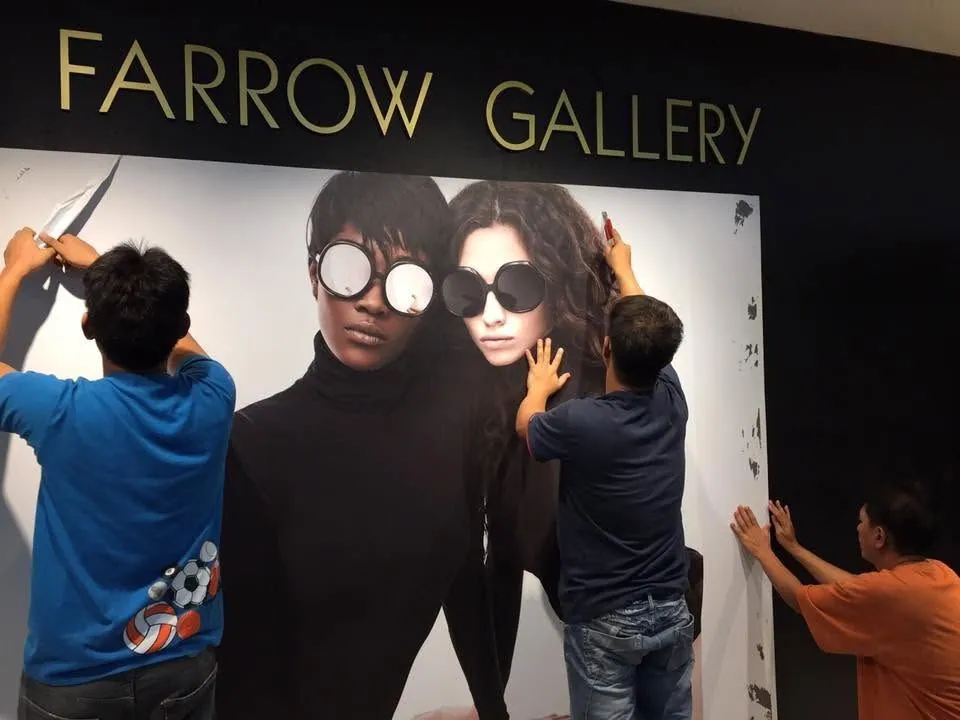 MCAV crew installing a Linda Farrow vinyl graphics