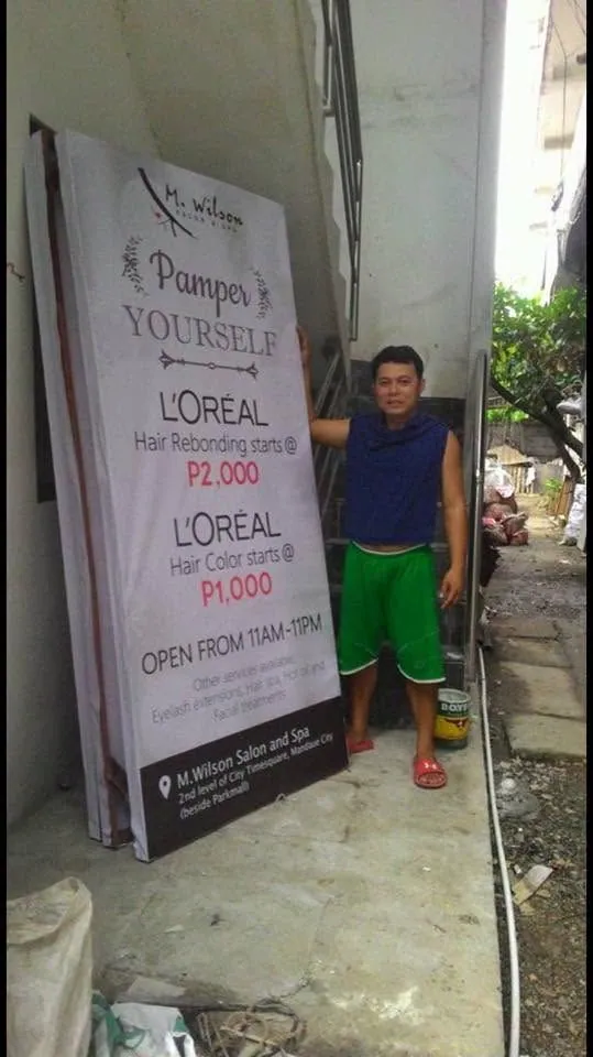 M. Wilson Salon and Spa framed tarpaulin, fresh off MCAV's printer