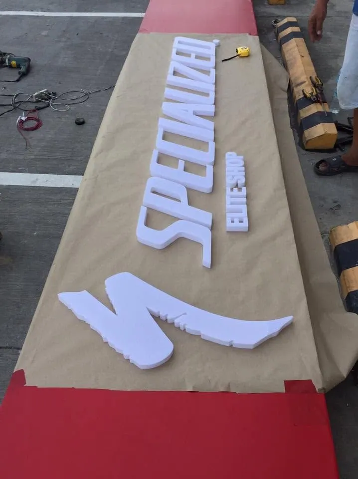 MCAV crew installing a Specialized acrylic built-up letters