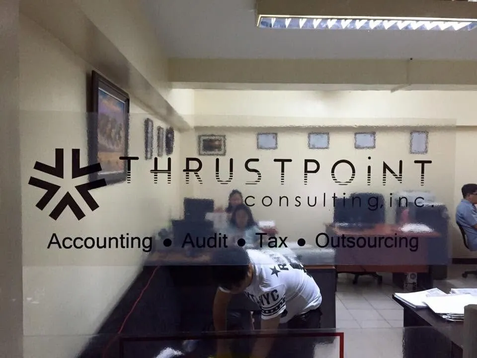 MCAV crew installing a Thrustpoint Consulting Inc. vinyl graphics